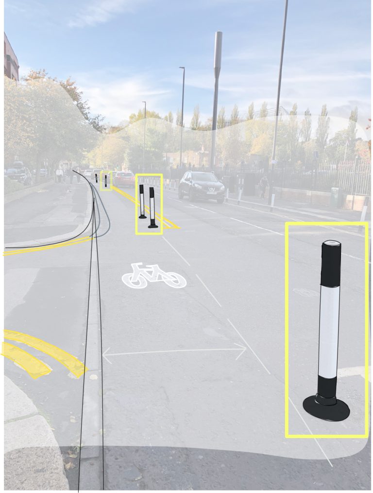 Temporary bollards on Queen Victoria Road, 2021.